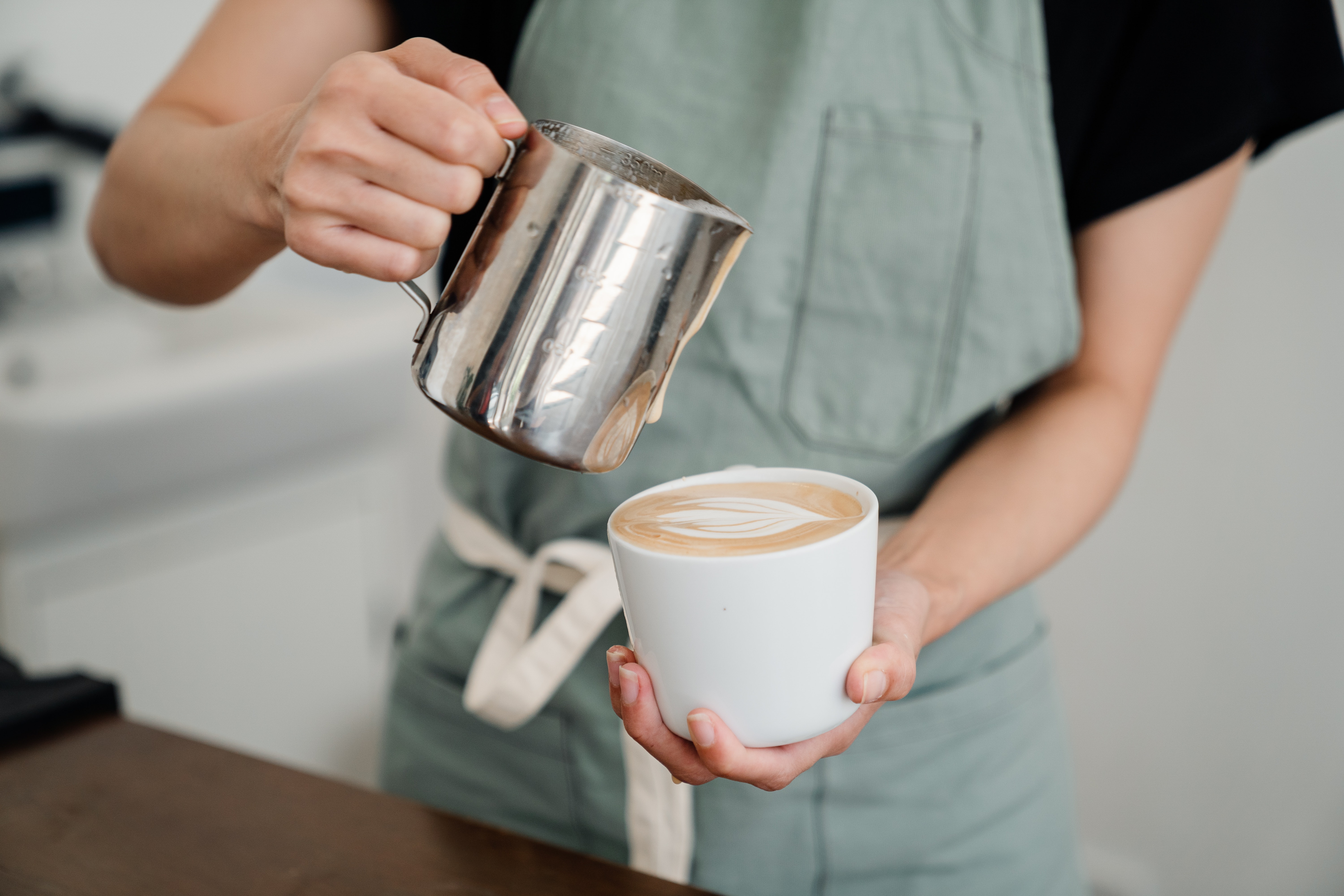Café Barista Pouring Coffee